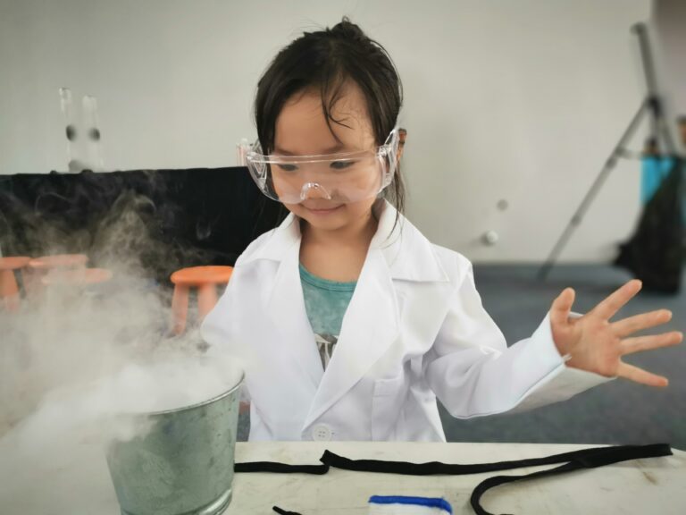 Children engaging in fun and educational STEM experiments, including a volcano eruption, balloon-powered car, and walking water science activity.